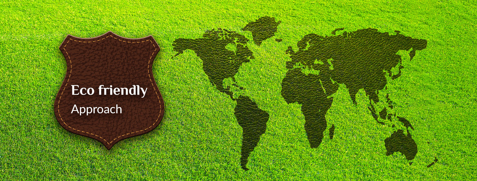 World map rendered in grass beside a leather badge — an eco-friendly approach